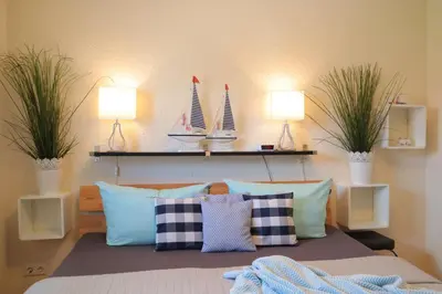 Ein Bett oder Betten in einem Zimmer der Unterkunft Ferienhaus Strandkorb