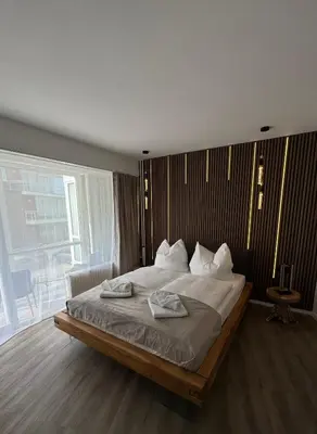 Ein Bett oder Betten in einem Zimmer der Unterkunft Strandjuwel in der Seehütte Cuxhaven Duhnen- Exclusive Ferienwohnung am Strand mit Meerblick