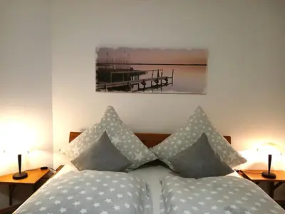 Ein Bett oder Betten in einem Zimmer der Unterkunft Fewo Muschel