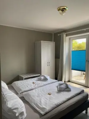 Ein Bett oder Betten in einem Zimmer der Unterkunft Pension Haus Meeresgruss