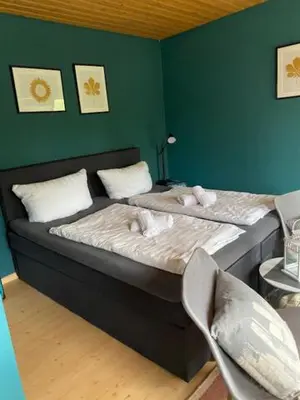 Ein Bett oder Betten in einem Zimmer der Unterkunft Pension Haus Meeresgruss
