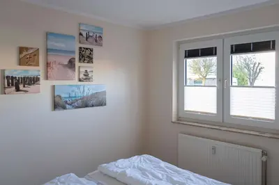 Ein Bett oder Betten in einem Zimmer der Unterkunft Haus Seemöwe, Whg 1