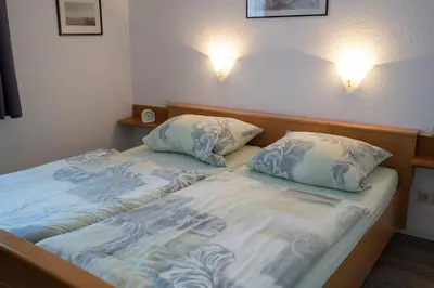 Ein Bett oder Betten in einem Zimmer der Unterkunft Schloß Am Meer - Wohnung 35