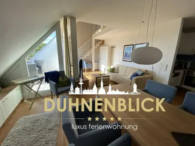 Ein Sitzbereich in der Unterkunft luxury holiday apartment Duhnenblick
