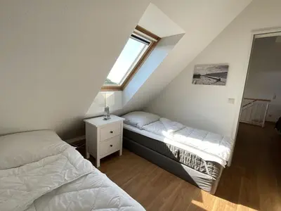 Ein Bett oder Betten in einem Zimmer der Unterkunft luxury holiday apartment Duhnenblick