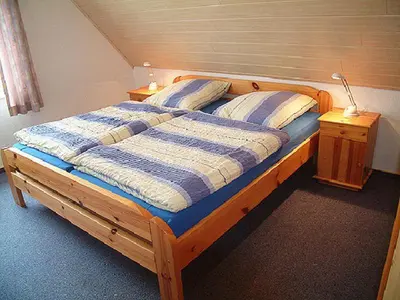 Ein Bett oder Betten in einem Zimmer der Unterkunft Haus Reni