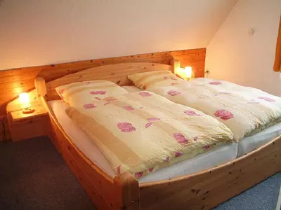 Ein Bett oder Betten in einem Zimmer der Unterkunft Haus Reni