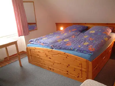 Ein Bett oder Betten in einem Zimmer der Unterkunft Haus Reni