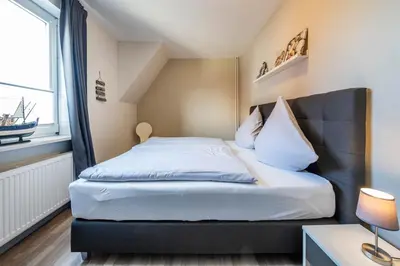 Ein Bett oder Betten in einem Zimmer der Unterkunft Op de Westerwarft Wohnung 4
