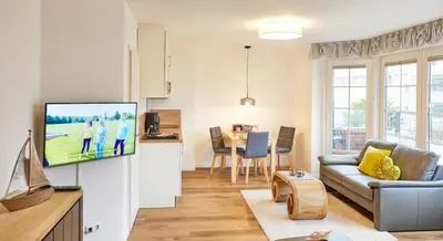 TV/Unterhaltungsangebot in der Unterkunft Ferienwohnung mit Meerblick Grimmershörnbucht