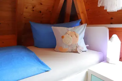Ein Bett oder Betten in einem Zimmer der Unterkunft Ferienhaus Mika