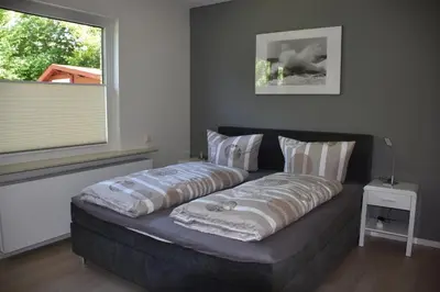 Ein Bett oder Betten in einem Zimmer der Unterkunft Strandkiesel