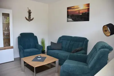 Ein Sitzbereich in der Unterkunft Strandkiesel