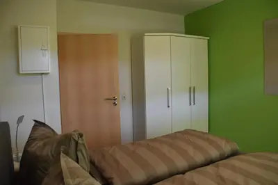 Ein Bett oder Betten in einem Zimmer der Unterkunft Strandkiesel