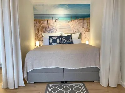 Ein Bett oder Betten in einem Zimmer der Unterkunft Strandhochhaus Sahlenburg FeWo H3