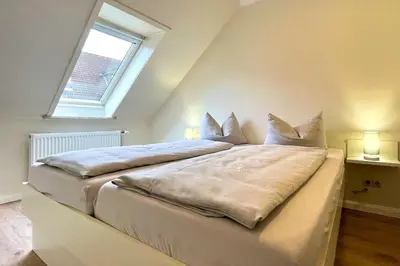 Ein Bett oder Betten in einem Zimmer der Unterkunft Ferienwohnungen Reimann Wohnung 11