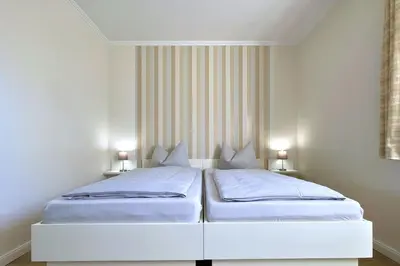 Ein Bett oder Betten in einem Zimmer der Unterkunft Ferienwohnungen Reimann Wohnung 10