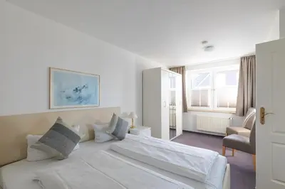 Ein Bett oder Betten in einem Zimmer der Unterkunft Haus Nordseeperle Wohnung 6