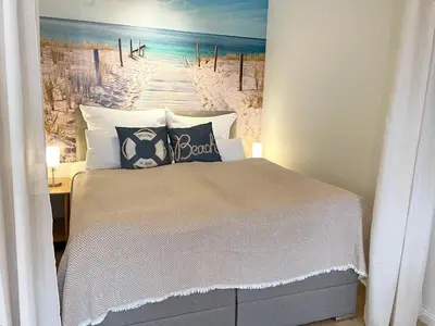 Ein Bett oder Betten in einem Zimmer der Unterkunft Strandhochhaus Sahlenburg FeWo H3
