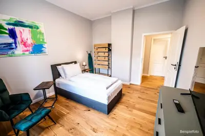 Ein Bett oder Betten in einem Zimmer der Unterkunft 4 Zimmer neues luxuriöses City Apartment Terrasse tolle Einzelbetten ruhig