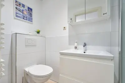 Ein Badezimmer in der Unterkunft Direkt an der Perlebucht - Wattn' Glück by Nordic Homes