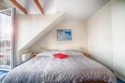 Ein Bett oder Betten in einem Zimmer der Unterkunft Elbstrom, Ferienwohnung 21