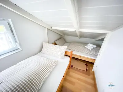 Ein Bett oder Betten in einem Zimmer der Unterkunft Elise am Meer - Ringwall 107