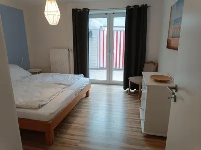 Ein Bett oder Betten in einem Zimmer der Unterkunft Küstenhaus Duhnen - Wohnung 2 im Erdgeschoss