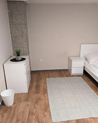 Ein Bett oder Betten in einem Zimmer der Unterkunft Große Landhauswohnung