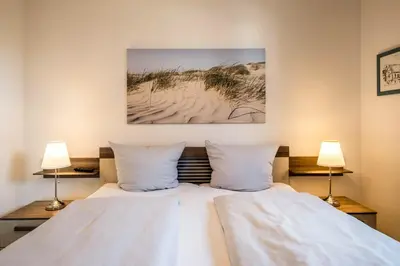 Ein Bett oder Betten in einem Zimmer der Unterkunft Wohnung 111