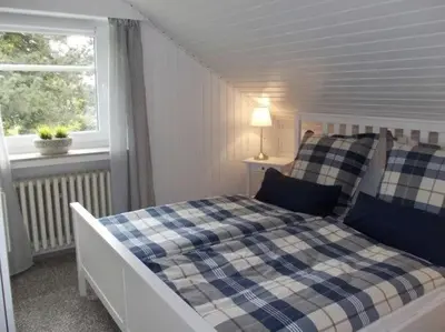 Ein Bett oder Betten in einem Zimmer der Unterkunft Pfötchenparadies I