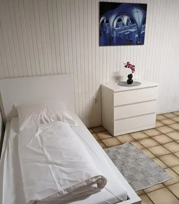 Ein Bett oder Betten in einem Zimmer der Unterkunft Monteurwohnung bei Covestro & Yara