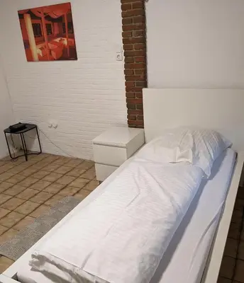 Ein Bett oder Betten in einem Zimmer der Unterkunft Monteurwohnung bei Covestro & Yara