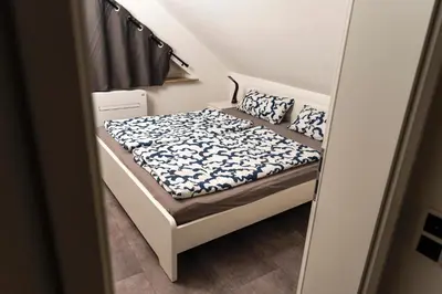 Ein Bett oder Betten in einem Zimmer der Unterkunft Strandnahe Ferienwohnung Nordsee Oase Whg 1