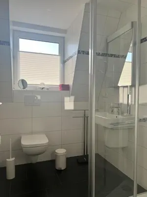 Ein Badezimmer in der Unterkunft Düne 1, Ferienwohnung 9