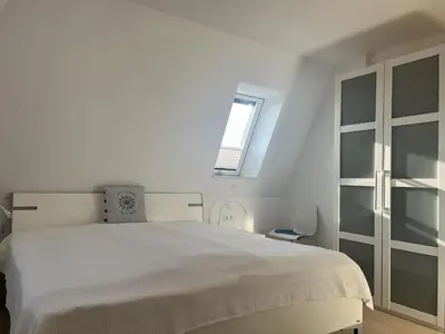 Ein Bett oder Betten in einem Zimmer der Unterkunft Düne 1, Ferienwohnung 9