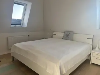 Ein Bett oder Betten in einem Zimmer der Unterkunft Düne 1, Ferienwohnung 9