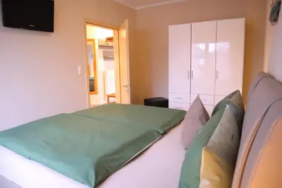 Ein Bett oder Betten in einem Zimmer der Unterkunft Villa am Meer - Antje
