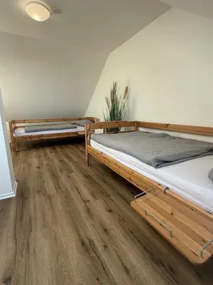 Ein Bett oder Betten in einem Zimmer der Unterkunft Dat Stürboord - Nordseeblick, Pool & Sauna