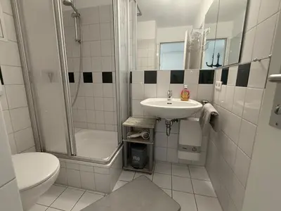 Ein Badezimmer in der Unterkunft Dat Stürboord - Nordseeblick, Pool & Sauna