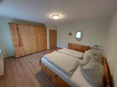 Ein Bett oder Betten in einem Zimmer der Unterkunft Ferienhaus Auenland