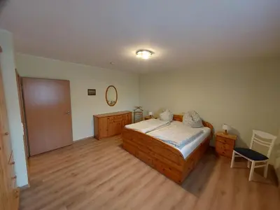 Ein Bett oder Betten in einem Zimmer der Unterkunft Ferienhaus Auenland