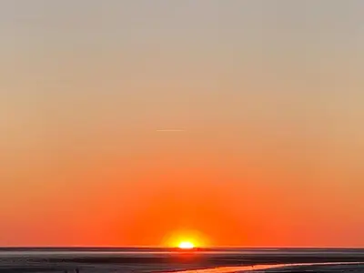 Blick auf den Sonnenuntergang/Sonnenaufgang von der Ferienwohnung aus oder aus der Nähe