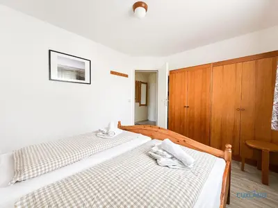 Ein Bett oder Betten in einem Zimmer der Unterkunft Haus Scharhörn Wohnung 4