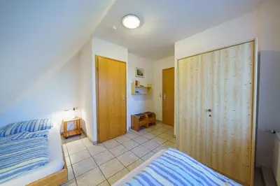 Ein Bett oder Betten in einem Zimmer der Unterkunft Achtern Diek 28A