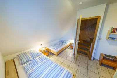Ein Bett oder Betten in einem Zimmer der Unterkunft Achtern Diek 28A