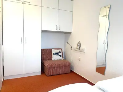 Ein Bett oder Betten in einem Zimmer der Unterkunft Frische Brise FeWo 03.09
