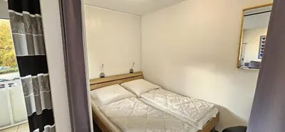 Ein Bett oder Betten in einem Zimmer der Unterkunft Frauenpreiss 203