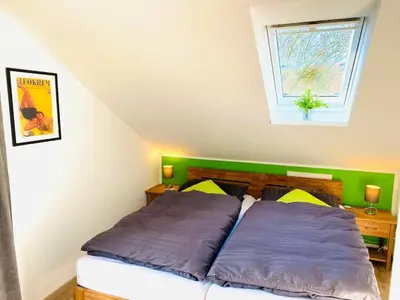 Ein Bett oder Betten in einem Zimmer der Unterkunft Lüttje Deichvilla Steuerbord