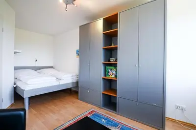 Ein Bett oder Betten in einem Zimmer der Unterkunft Haus Nordseebrandung NB63
